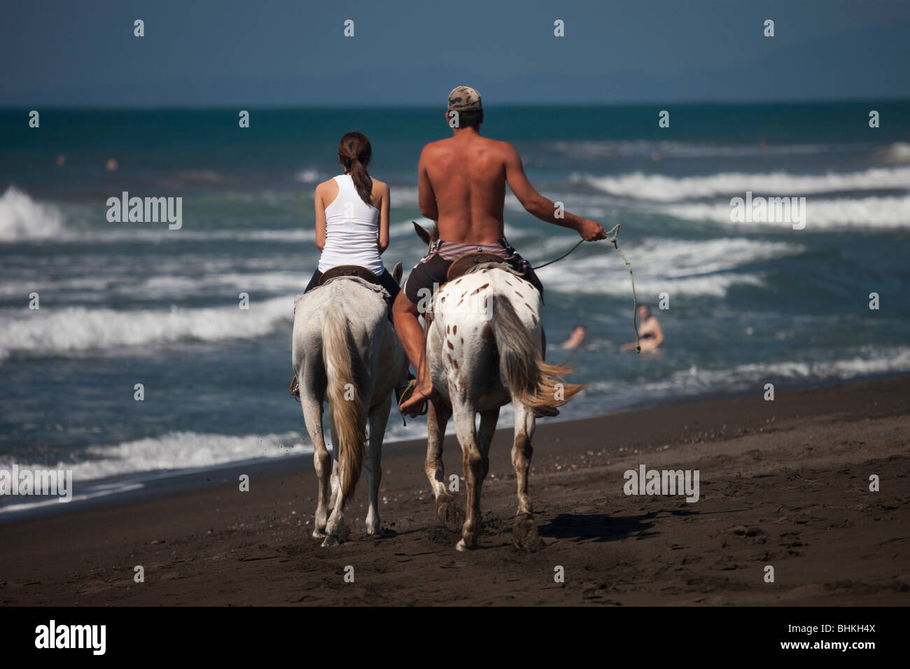 Horseback riding on Playa Hermosa, Puntarenas, Costa Rica Stock Photo