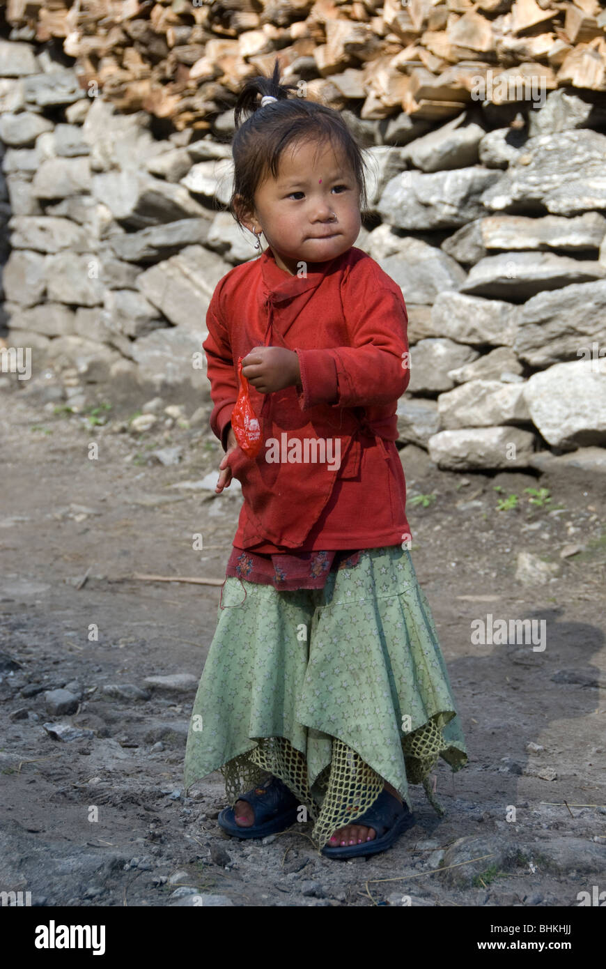 Small girl in village street, near Bagarchhap, Annapurna Circuit, Nepal ...
