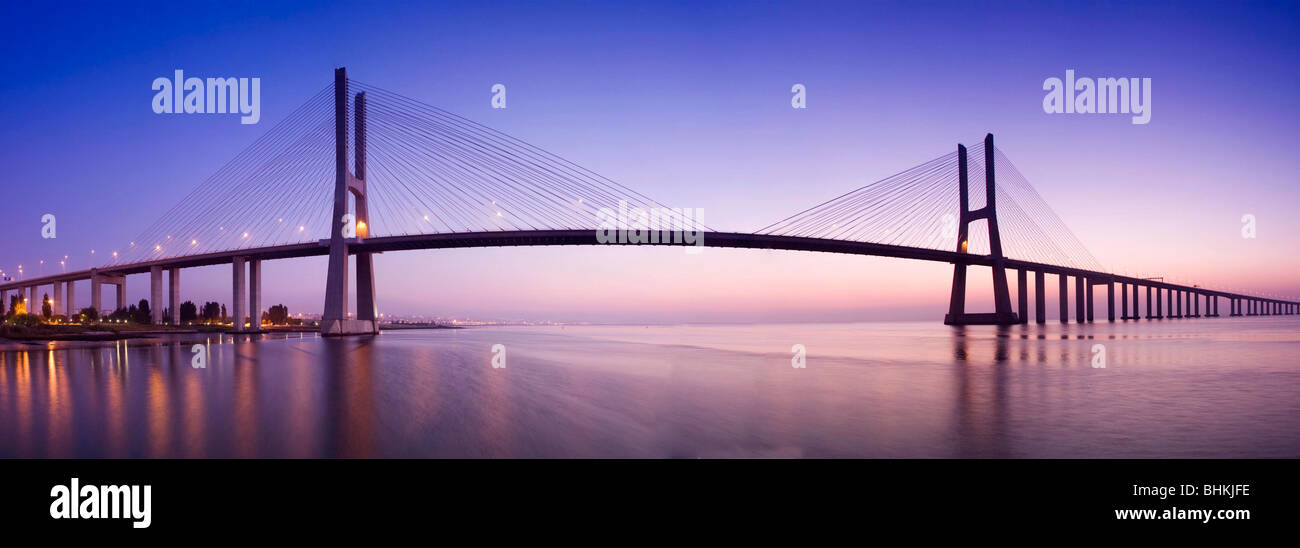 Portugal Lisbon Panoramic view of Vasco da Gama Cable-Stayed Bridge at dawn Stock Photo