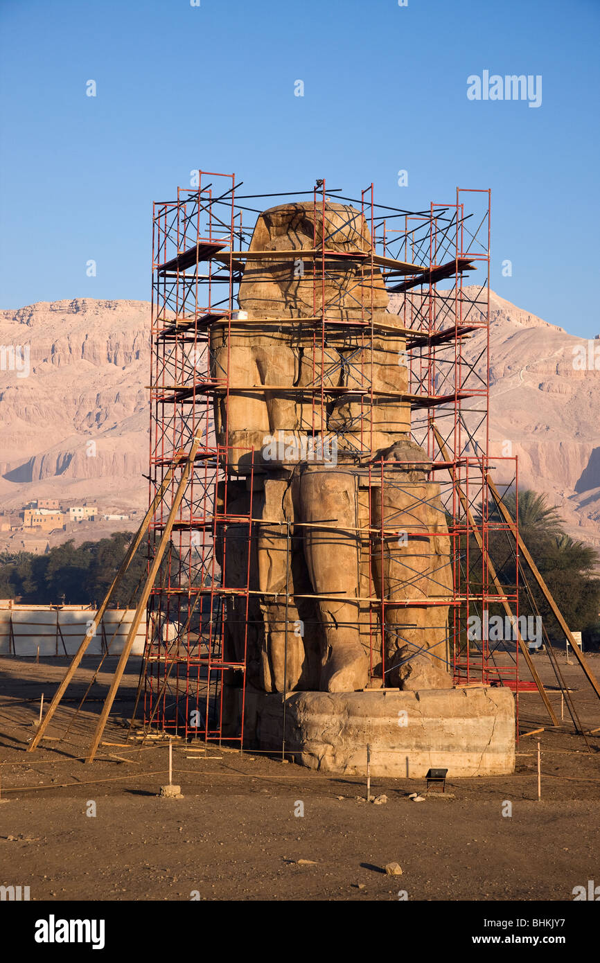 The east Colossus of Memnon, statue of Amenhotep III Stock Photo