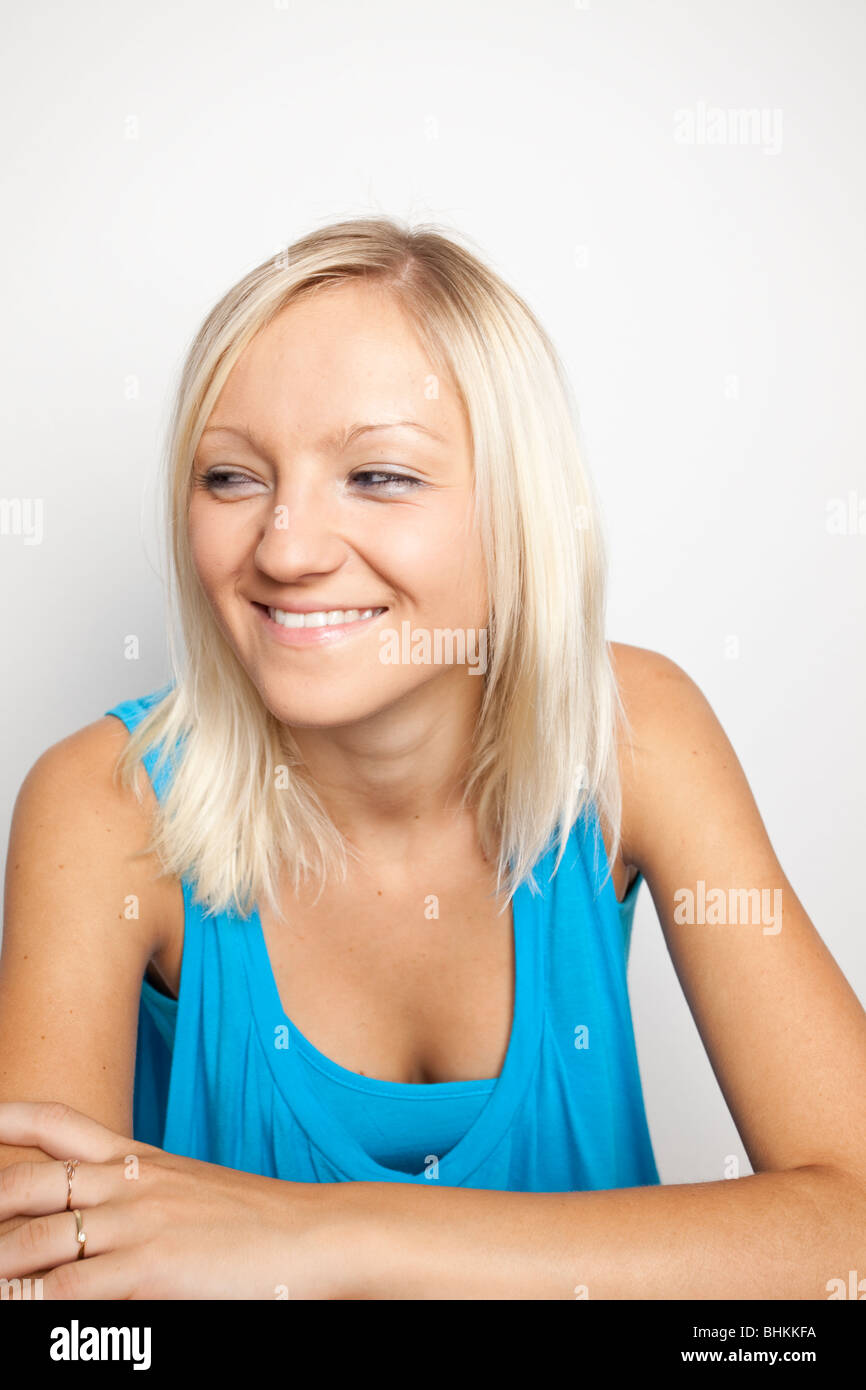 Portrait of a blond girl, smiling Stock Photo - Alamy