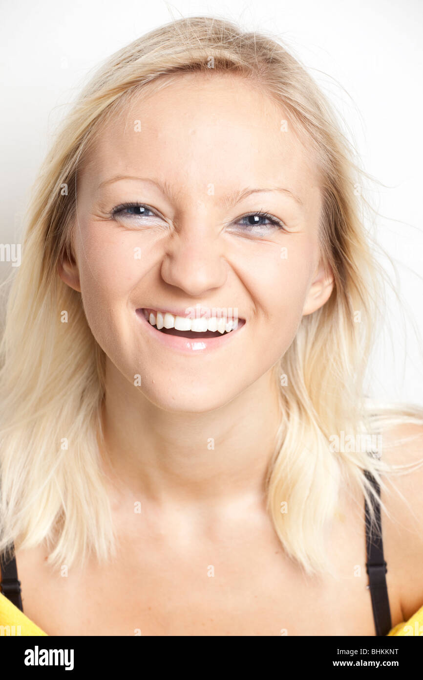 Portrait of a blond girl, smiling Stock Photo - Alamy