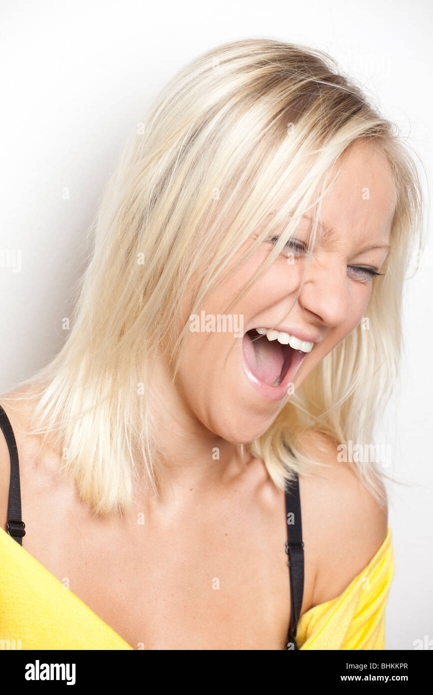 Portrait of a blond girl, smiling Stock Photo - Alamy