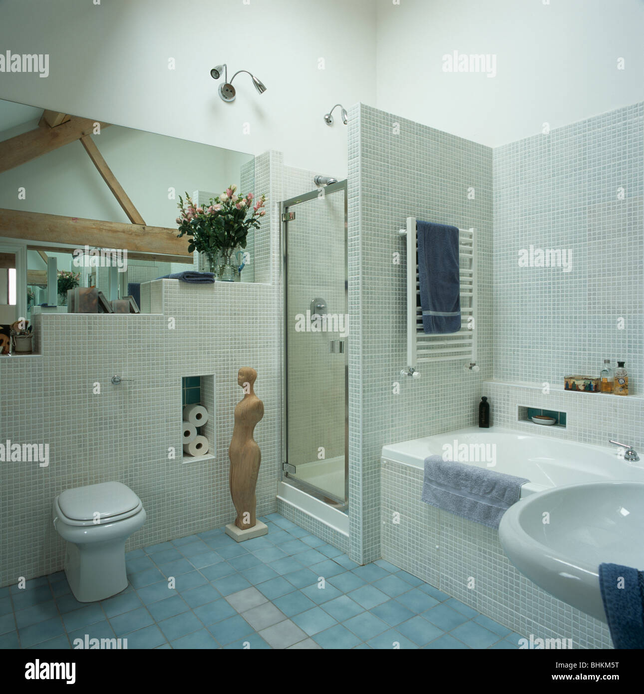 Large Mirror In Modern Barn Conversion Bathroom With Blue Tiled