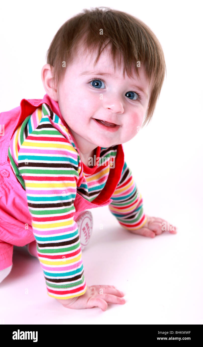 Baby girl starting to crawl Stock Photo - Alamy