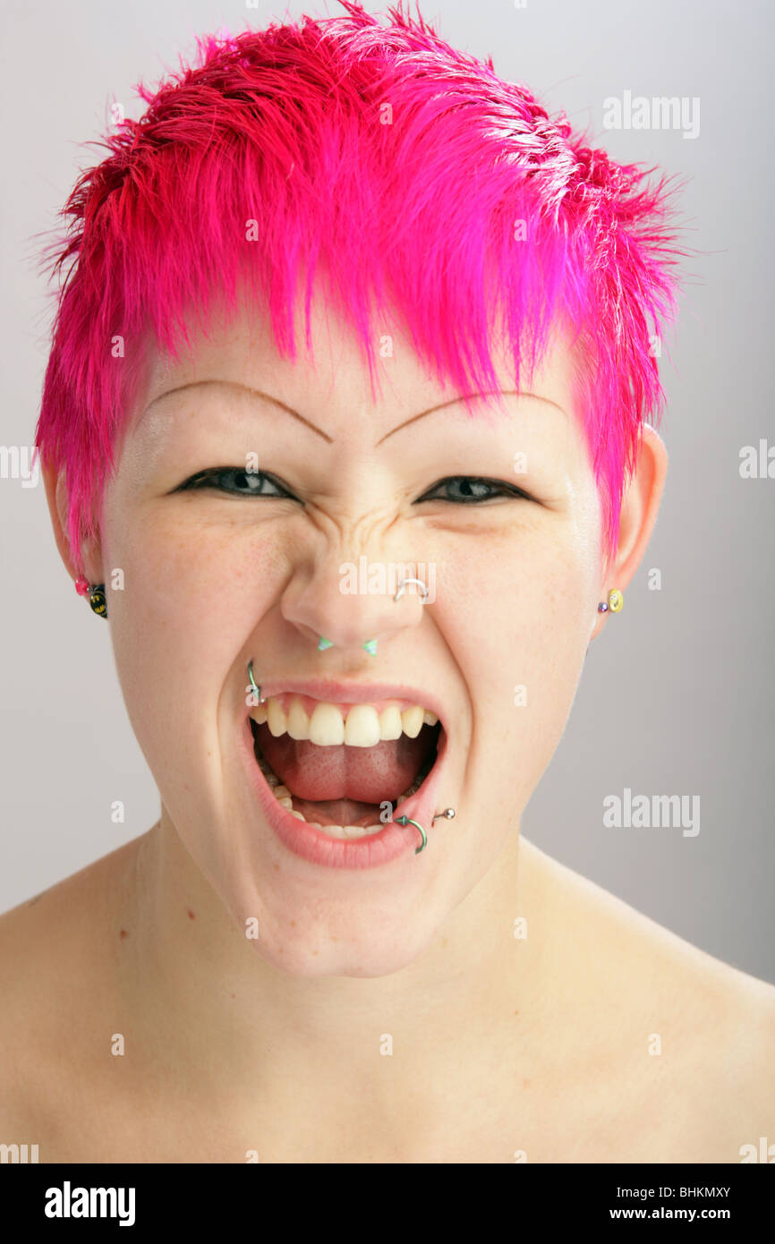 Woman with dyed pink hair shouting Stock Photo