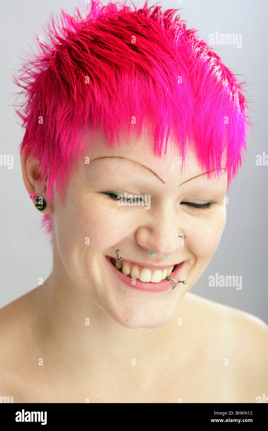 Happy smiling young woman with bright dyed hair. Stock Photo