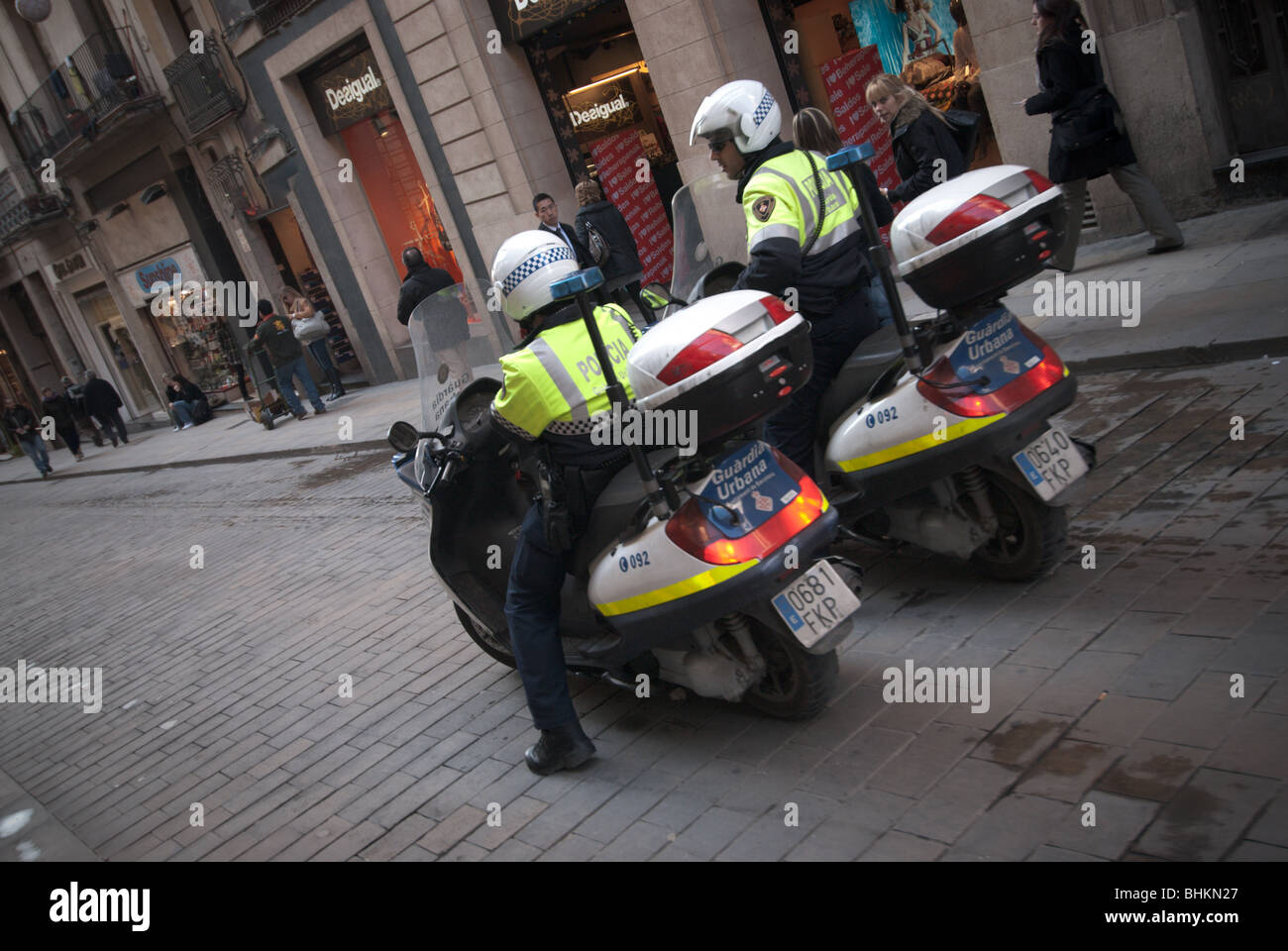 Local Police on motor bikes patrol the old centre of Barcelona Stock Photo Alamy