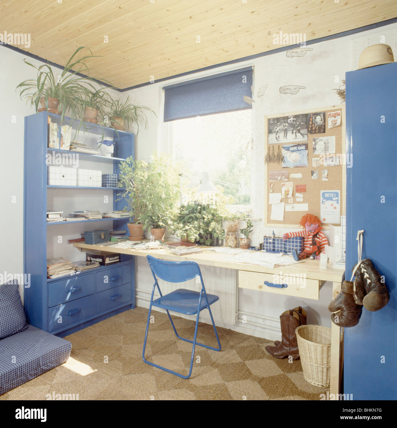 Blue Chair And Simple Wooden Desk In Teenager S Retro Study