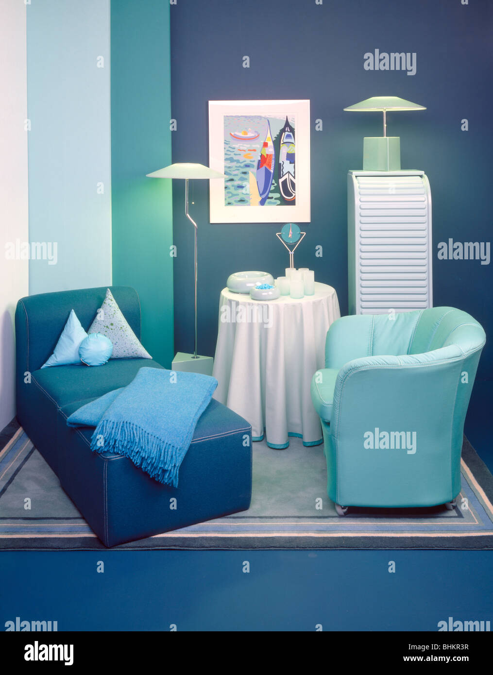 Light Blue Throw On Blue Chaise Longue In Blue Sixties Living Room With Pastel Turquoise Tub Chair And Table With White Cloth Stock Photo Alamy