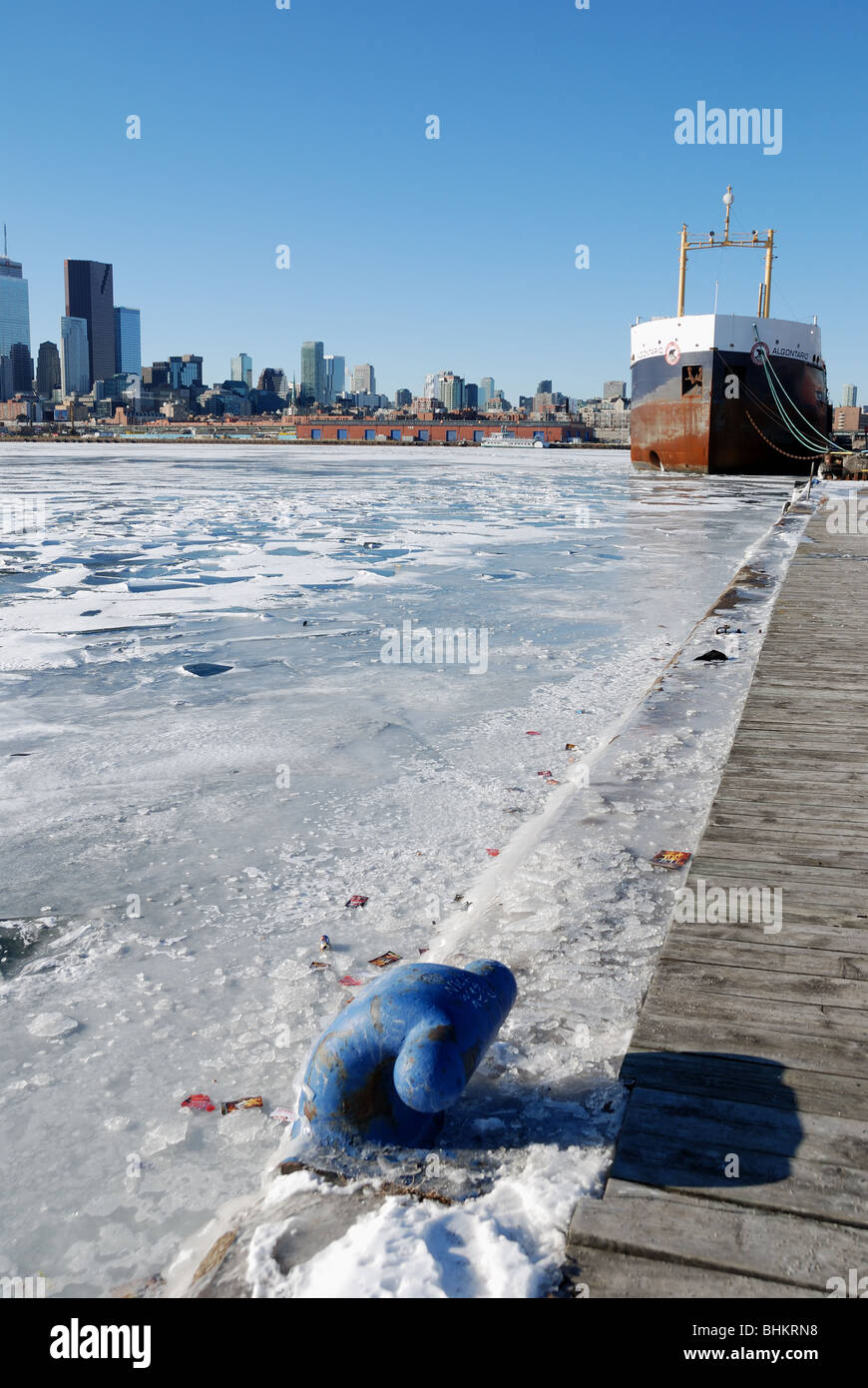 A view of a great lakes freighter secured in Toronto's frozen harbour  for the winter Stock Photo