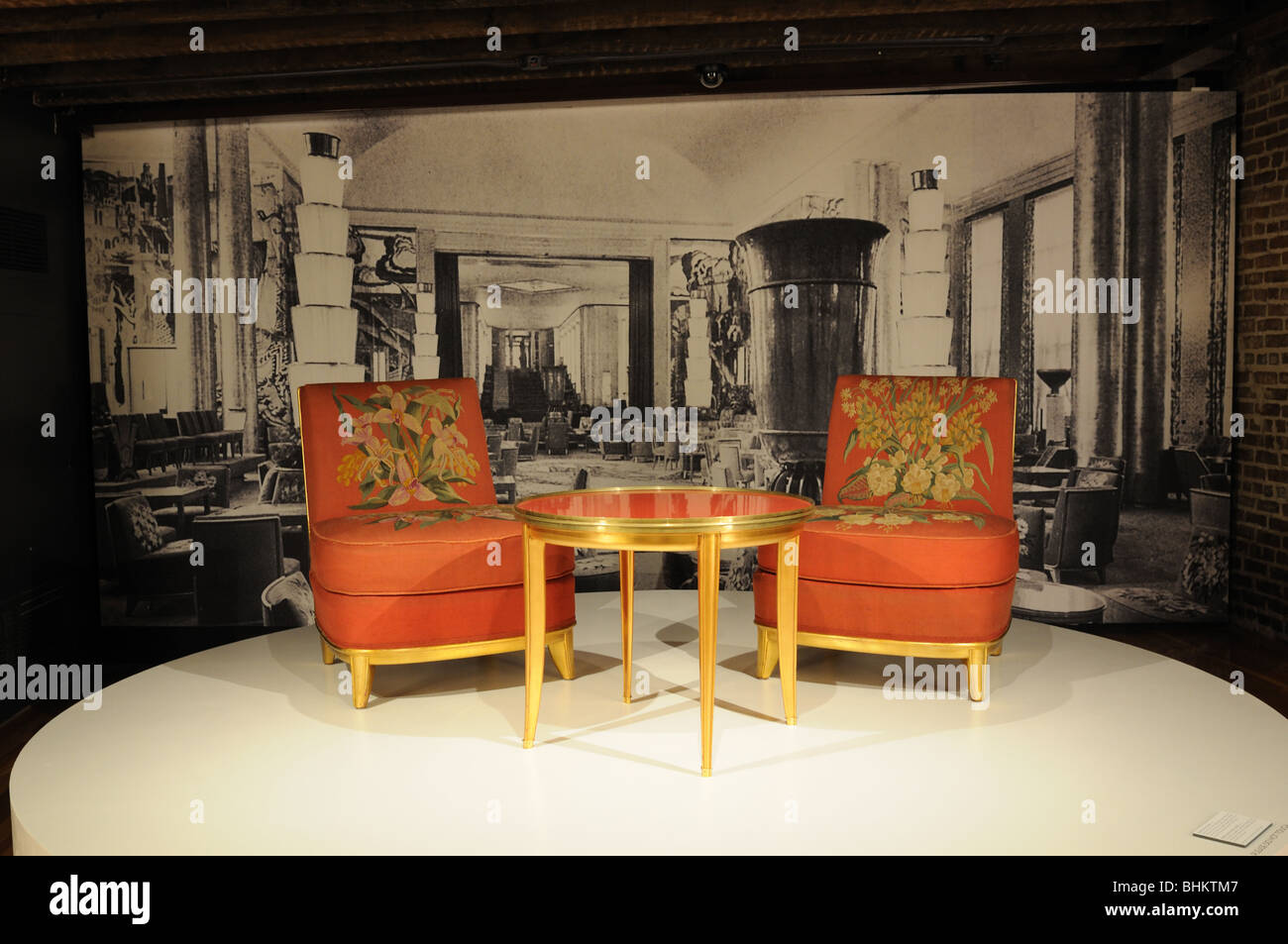 Chairs from the SS Normandie's dining salon are on exhibit at the South Street Seaport Museum along with a photo of the room. Stock Photo