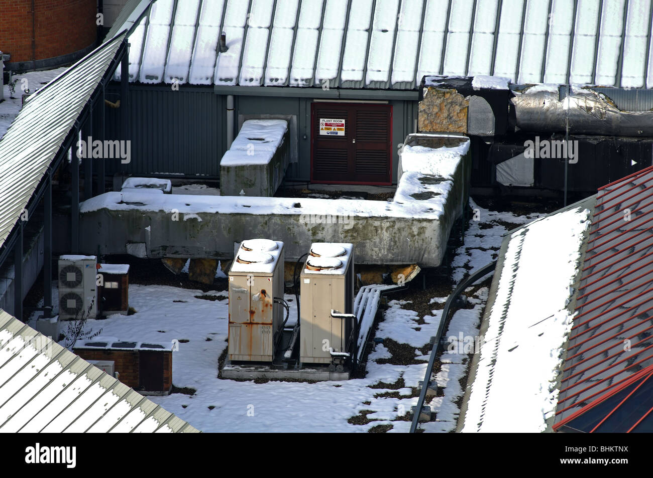 Rooftop airconditioning units with snow, Coventry city centre, England