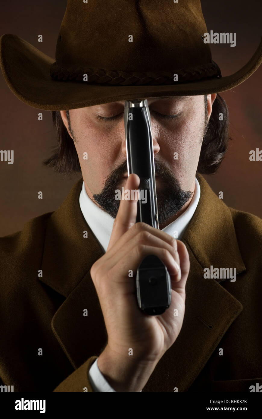 Cowboy with a hand gun hires stock photography and images Alamy