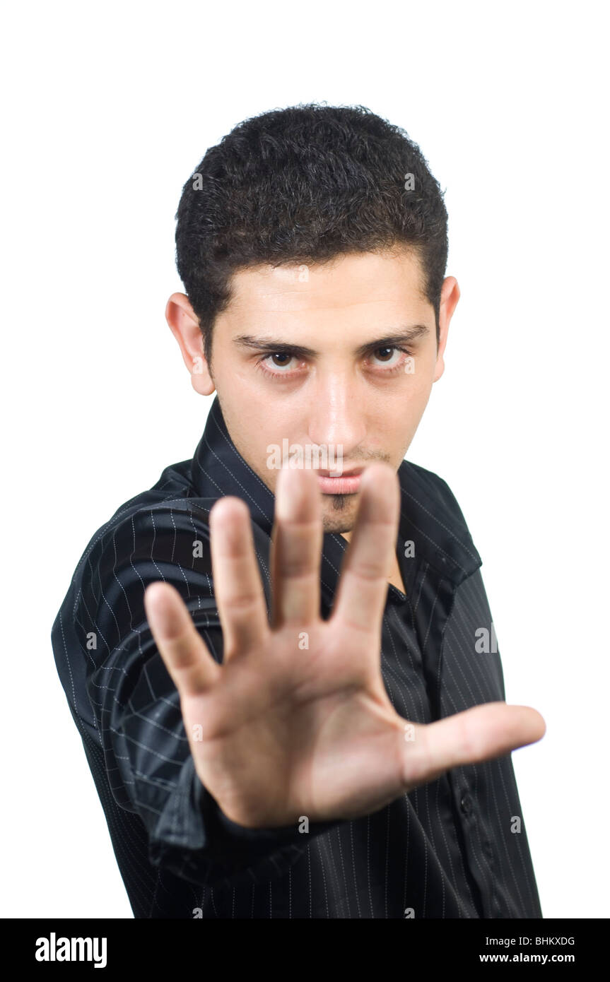 Young Teenager Showing A Hand As A Stop Gesture Against A White