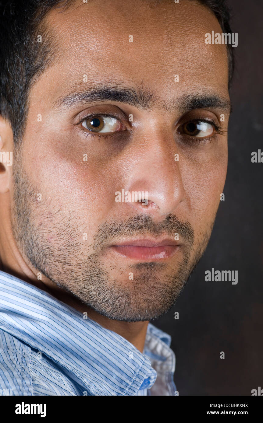 Close up of a serious Middle Eastern man's face thinking Stock Photo ...