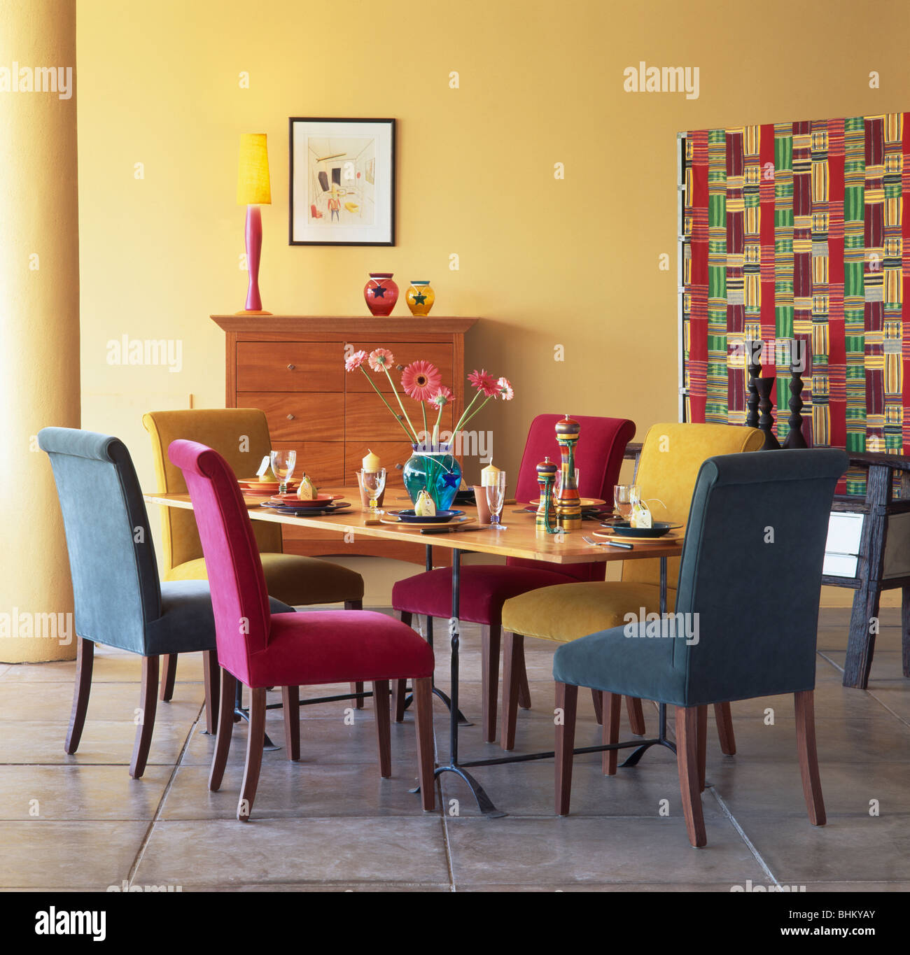 Yellow Dining Rooms / Yellow Dining Room Colors : A bold, geometric area rug in sunshine yellow brings the perfect amount of pattern to this dining room without detracting from the room's clean, modern aesthetic.