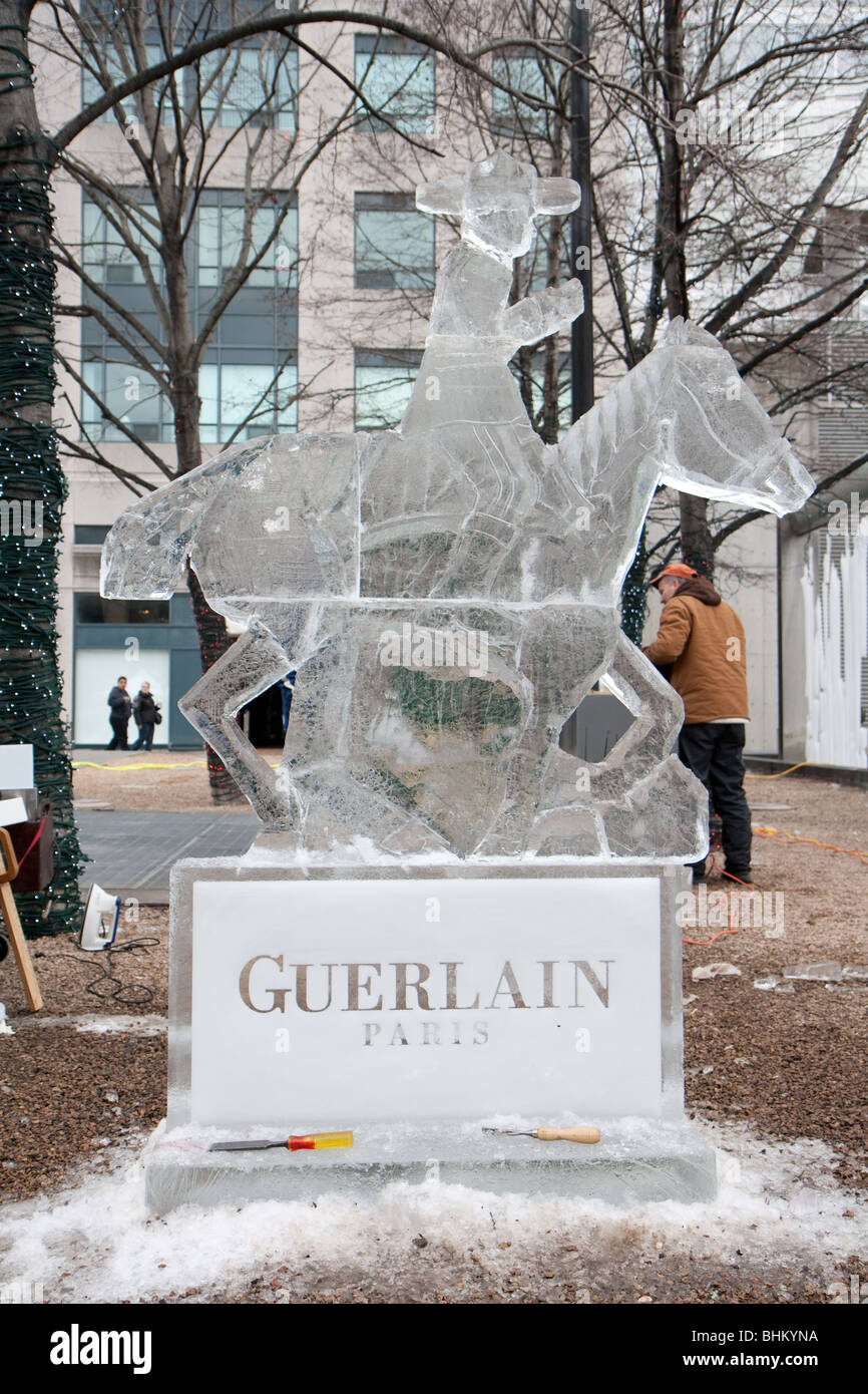 Guerlain ice sculpture on display outdoor during a cloudy winter afternoon Stock Photo