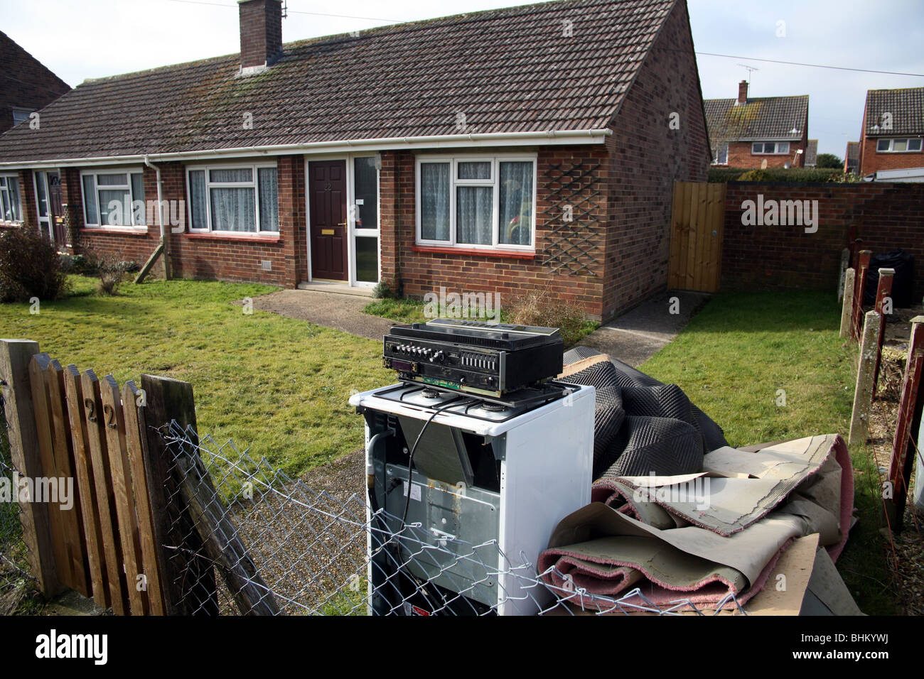 Rubbish piled up outside an empty house, bungalow Stock Photo Alamy