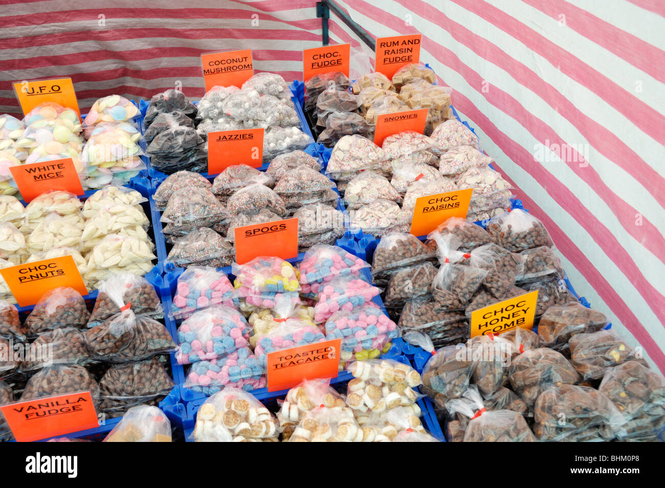 Assorted bags of sweets or candy on an English market stall in south west London, England, UK. Stock Photo