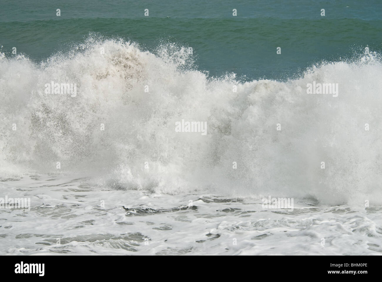Waves crashing on a beach Stock Photo - Alamy