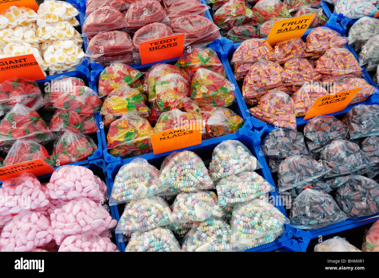 Assorted bags of sweets or candy on an English market stall in south