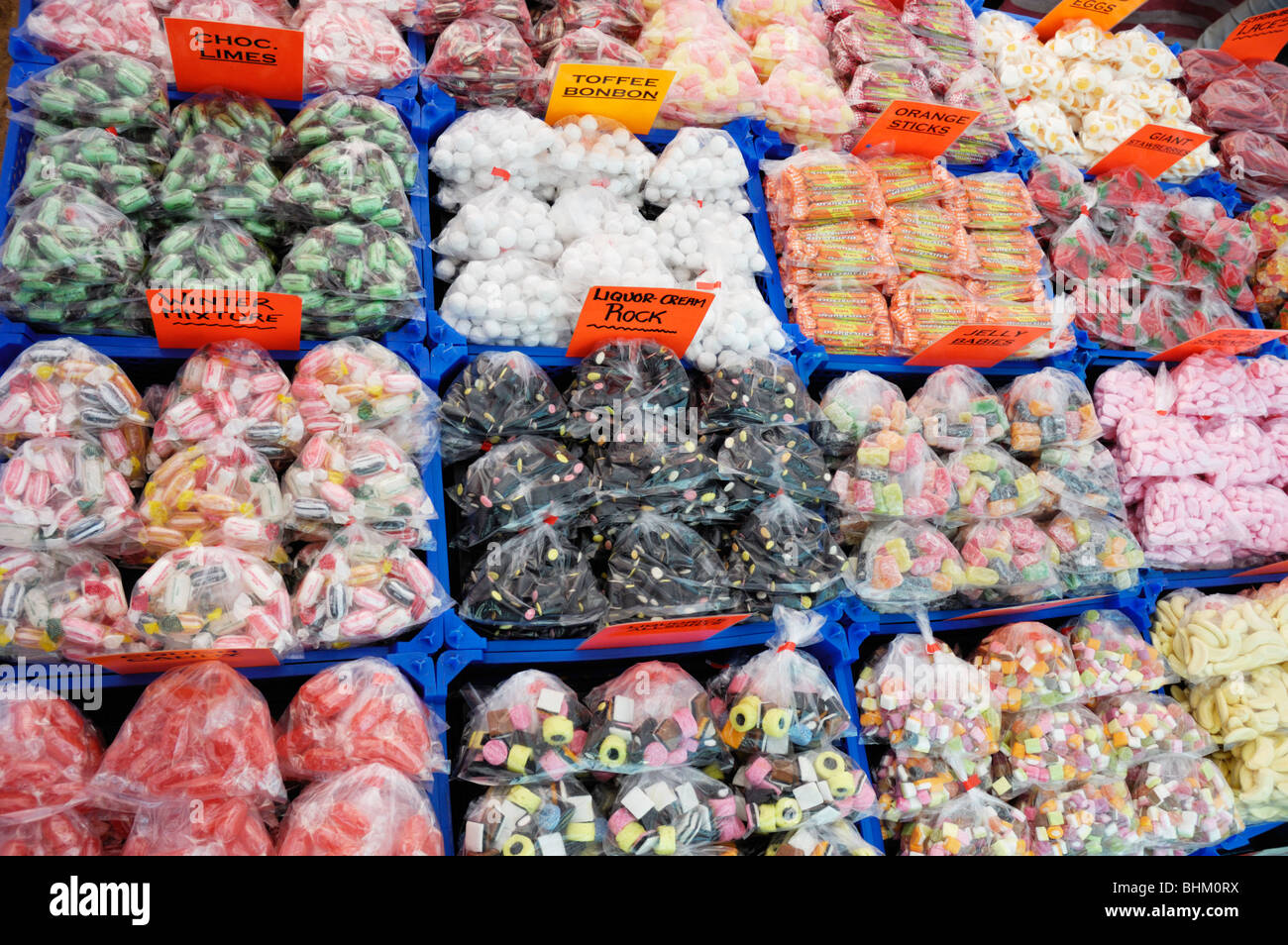 Assorted bags of sweets or candy on an English market stall in south