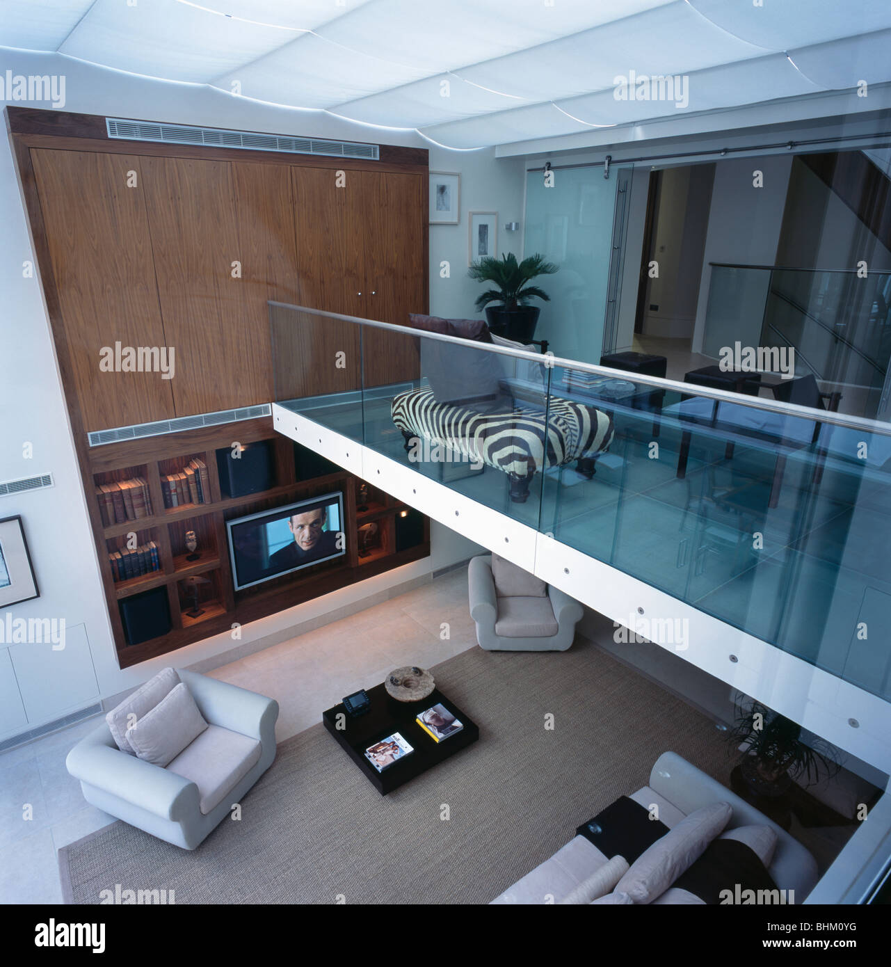 Birdseye View Of Large Open Plan Mezzanine Floor With Glass Half