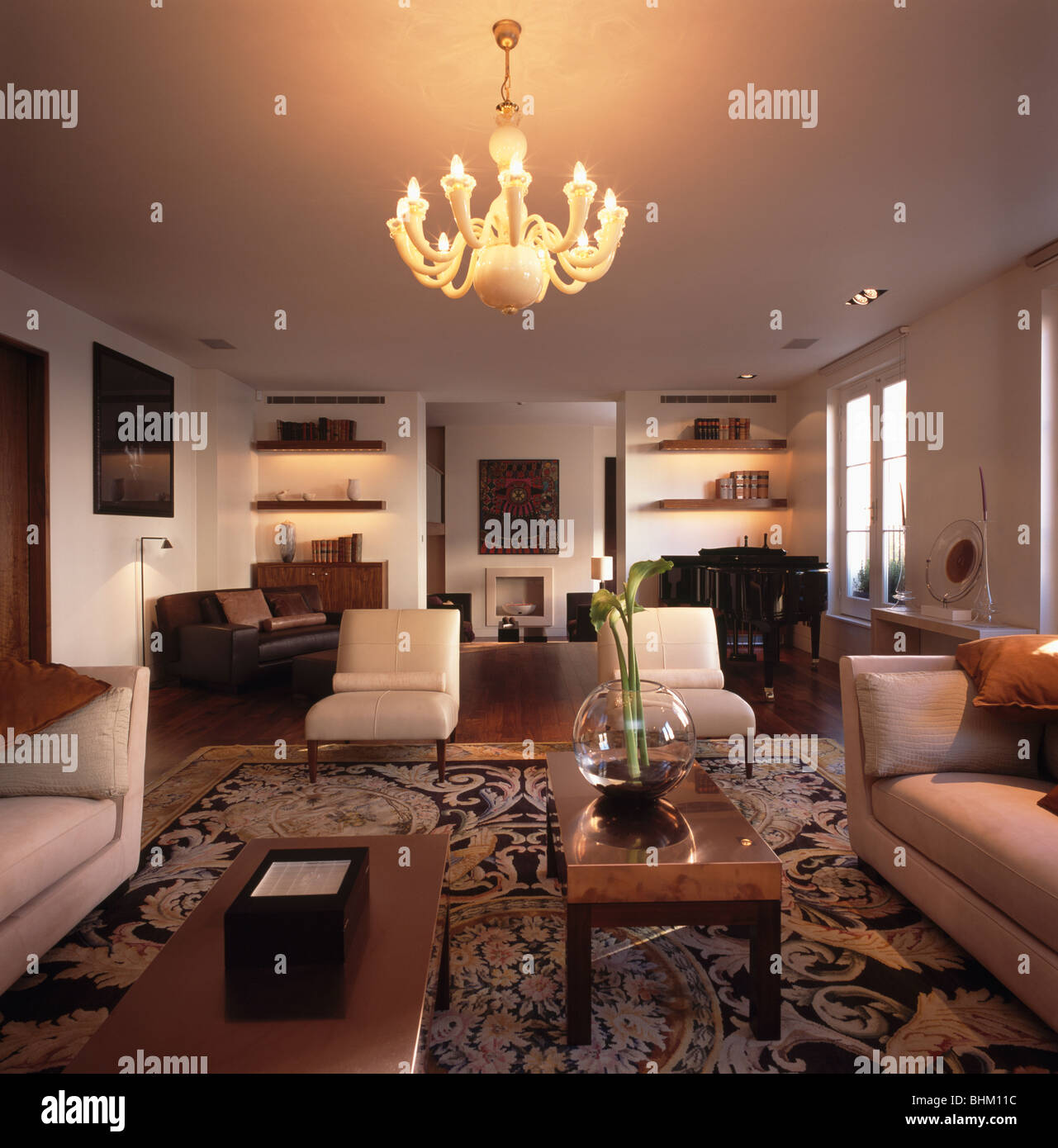 Lighted Ceiling Lights And Cream Leather Chairs In Modern Living