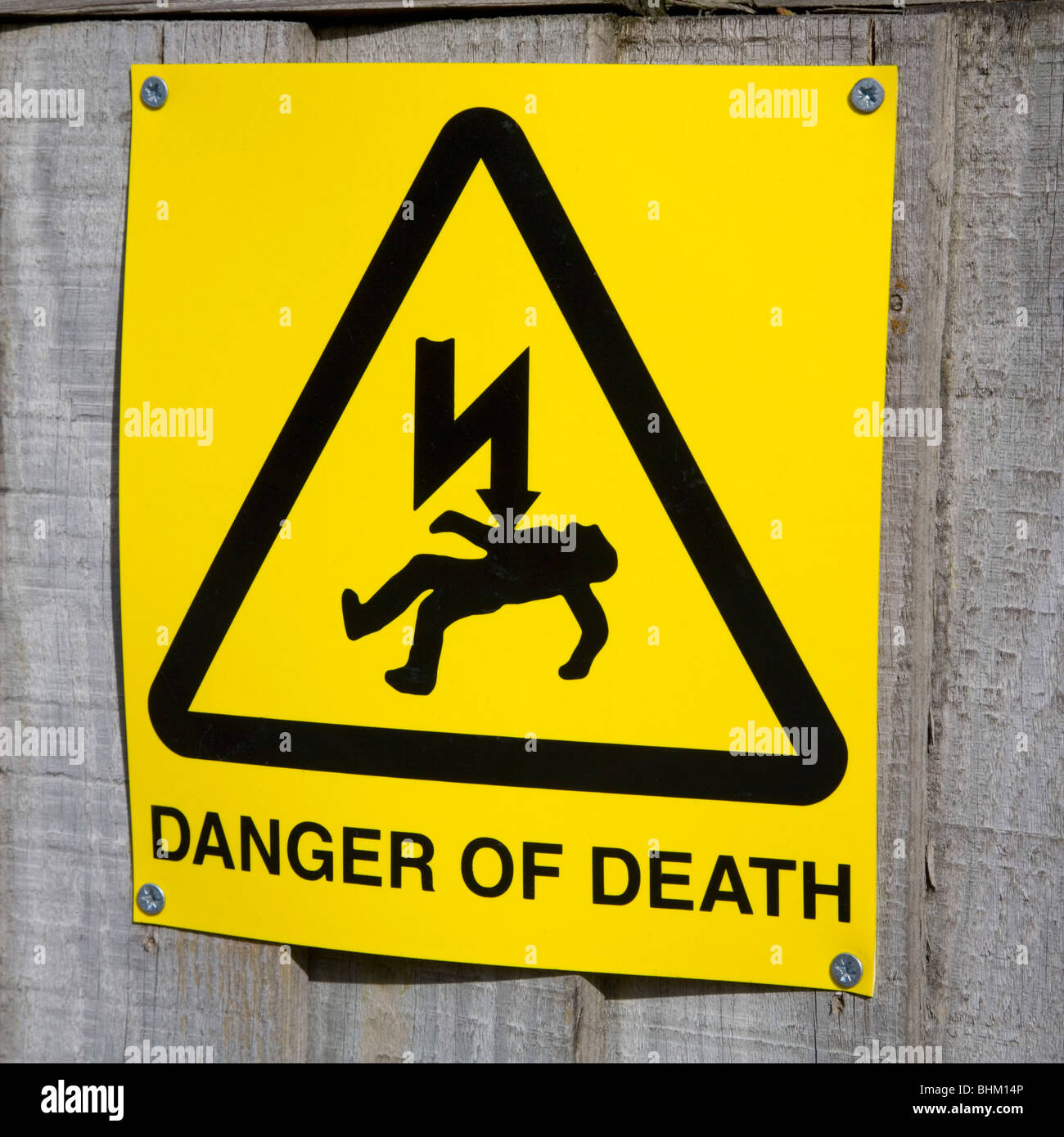 East Grinstead, West Sussex, England. Yellow sign warning of electrical hazard. Stock Photo