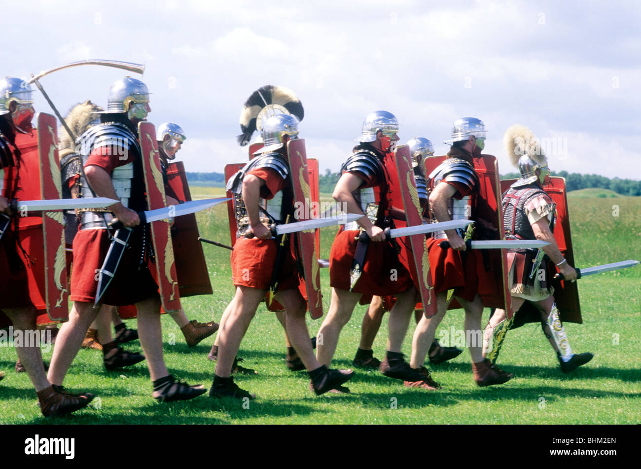 Roman soldiers marching, historical re-enactment England UK English history battle battles swords sword armour uniform costume Stock Photo