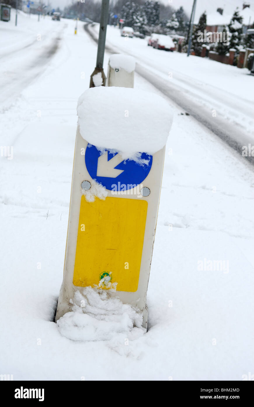 Keep Left Road Sign Winter Snow Fall. Stock Photo