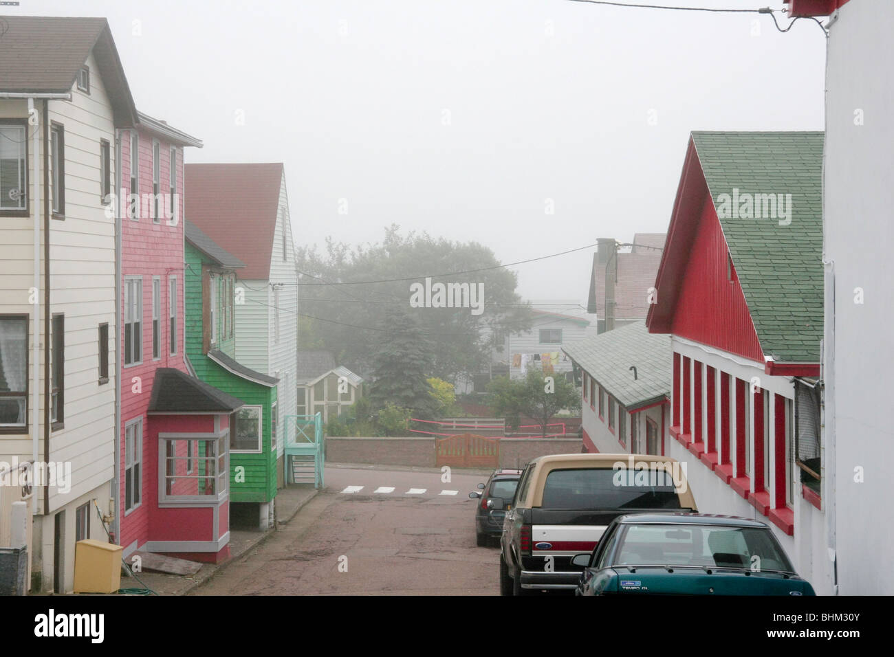 Colorful buildings in the fog at St Pierre, SPM (France) Stock Photo