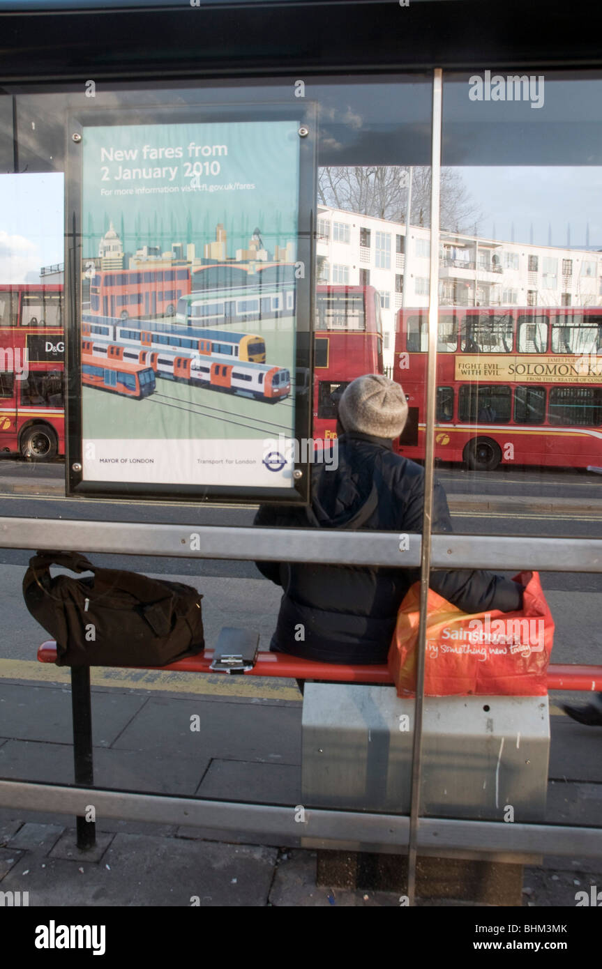 Bus stop uk london woman waiting hi-res stock photography and images ...