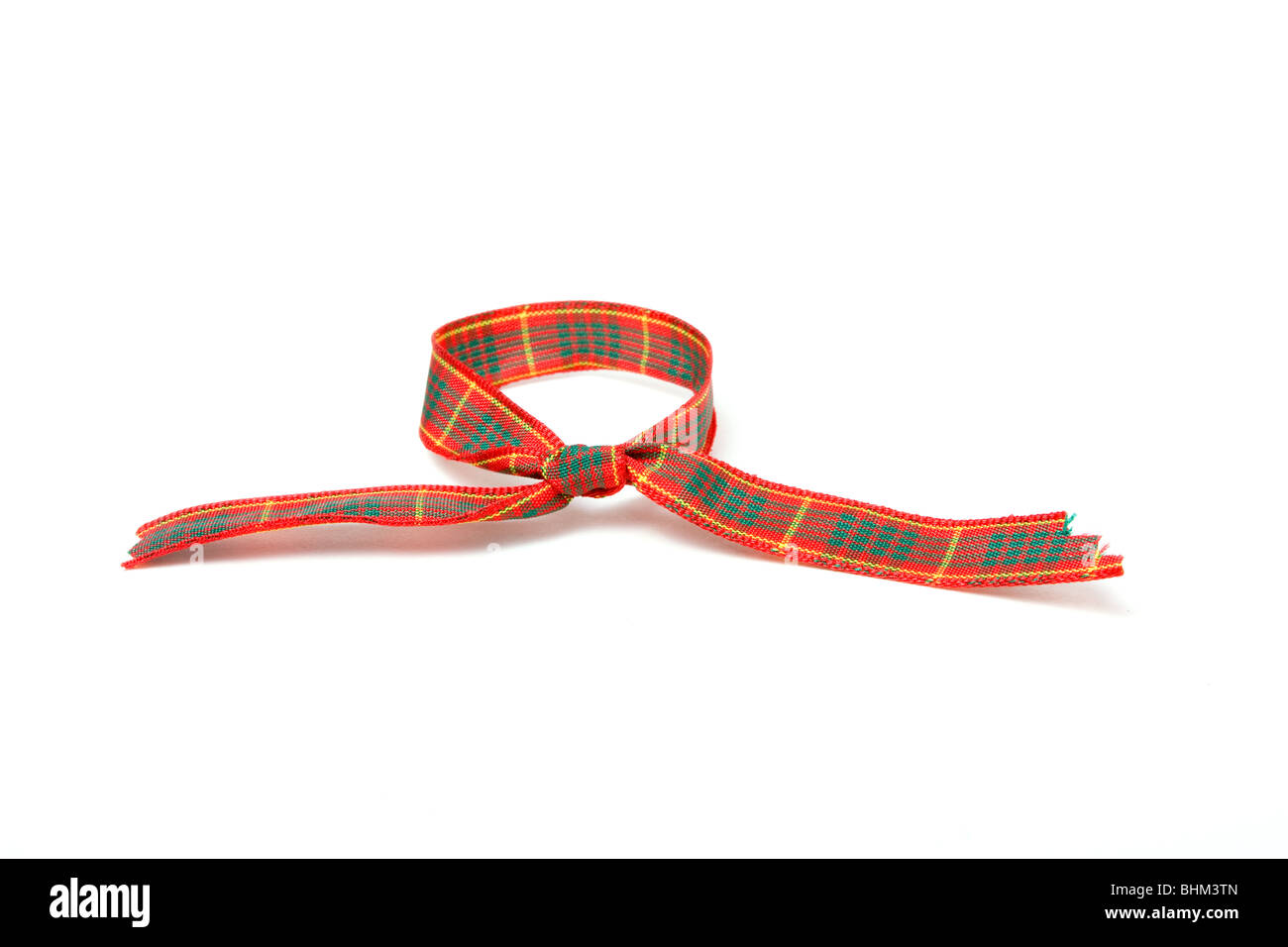 Vibrant tartan ribbon isolated against white background. Stock Photo