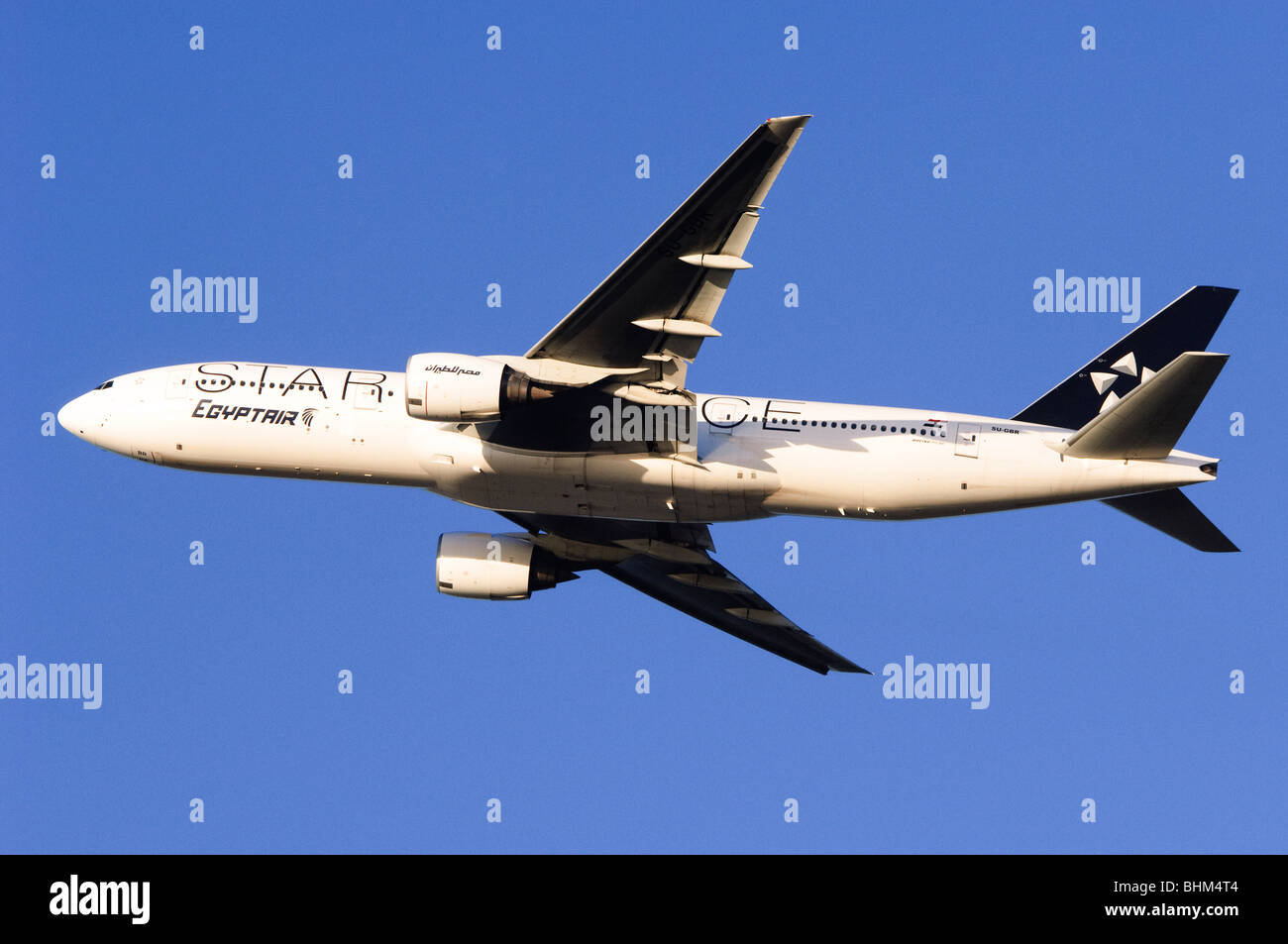 Boeing 777 operated by Star Alliance Egyptair climbing out from take off at London Heathrow Airport Stock Photo