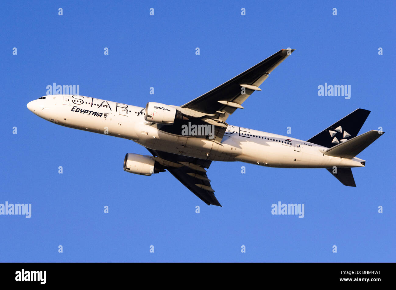 Boeing 777 operated by Star Alliance Egyptair climbing out from take off at London Heathrow Airport Stock Photo