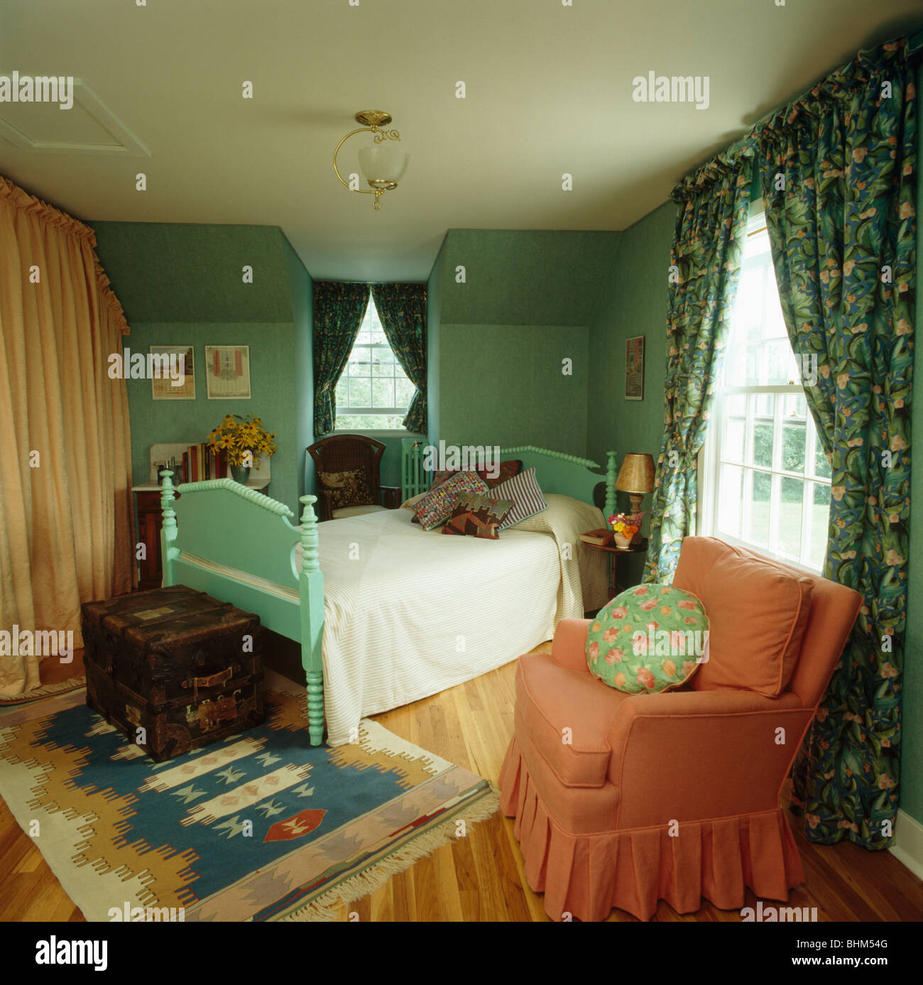 Patterned Rug And Turquoise Painted Wooden Bed In Turquoise
