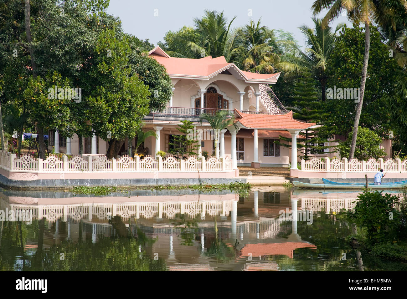 Traditional Indian house beside a river in Kerala, India Stock Photo