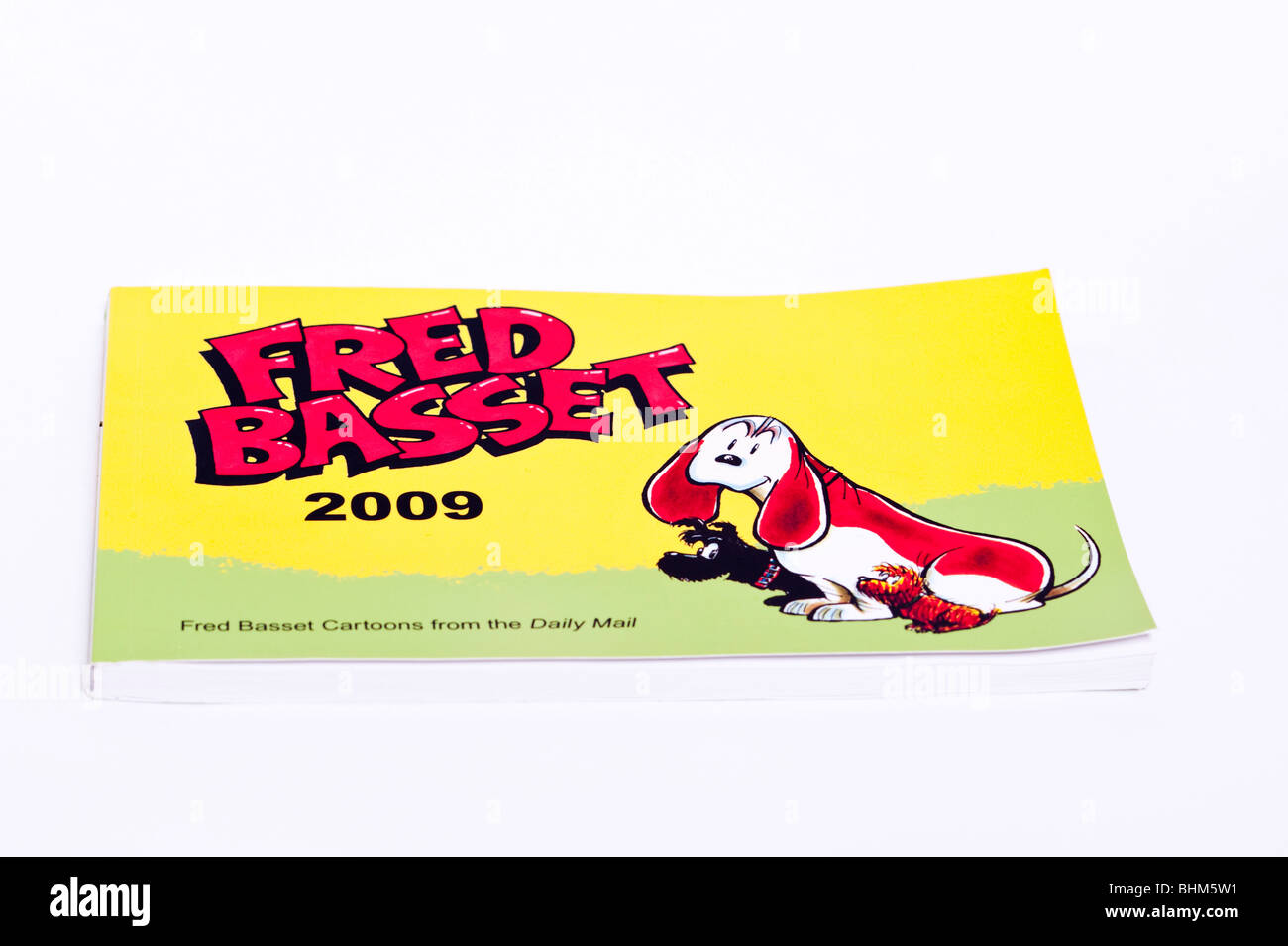 A Fred Basset cartoon book on a white background Stock Photo