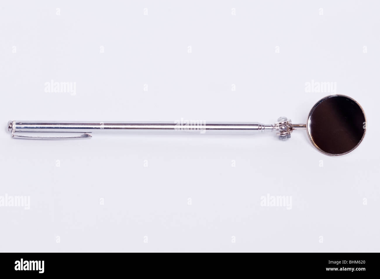 A telescopic mirror for viewing things in awkward places on a white background Stock Photo