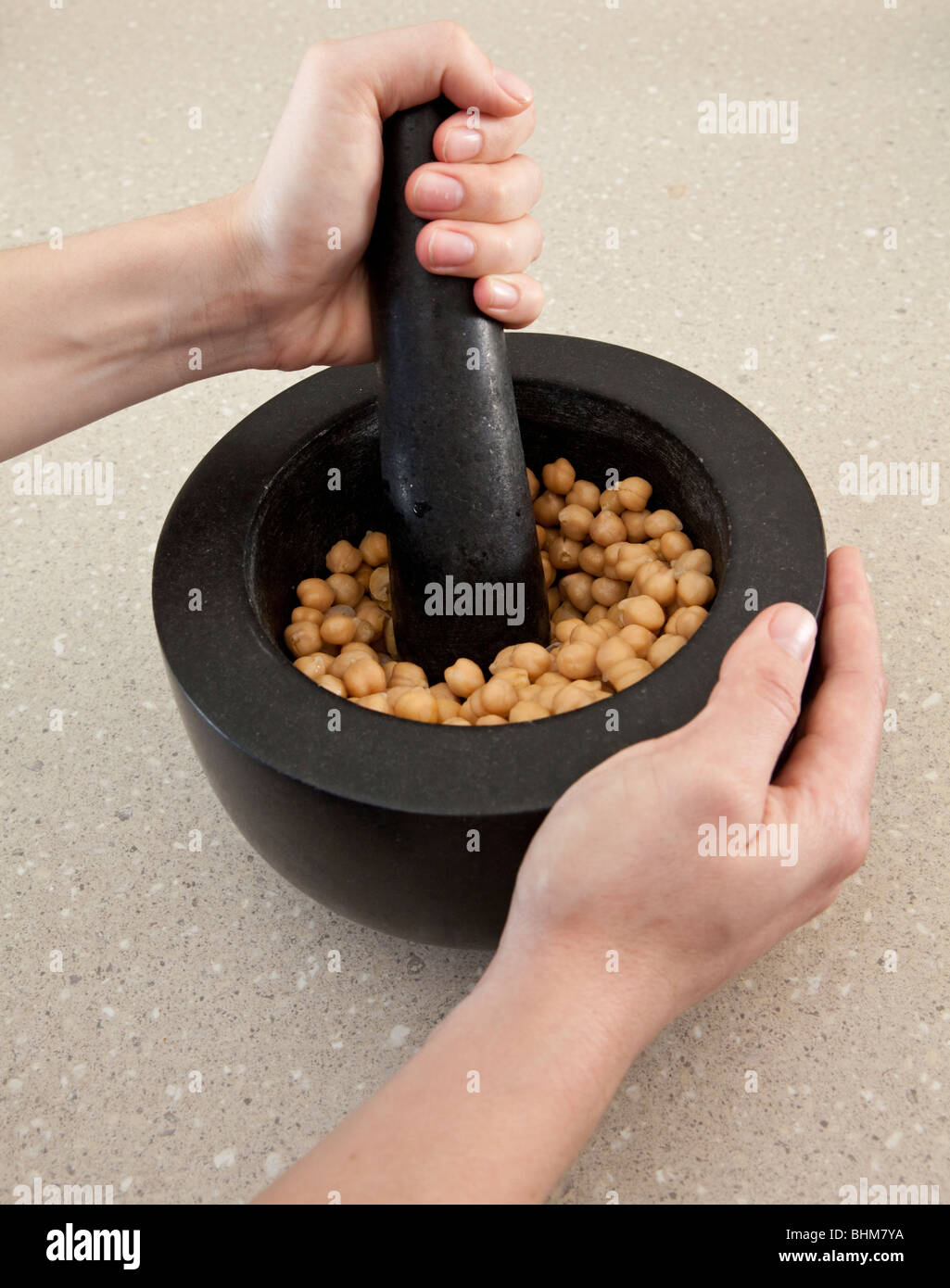 Chickpeas in a mortar and pestle Stock Photo