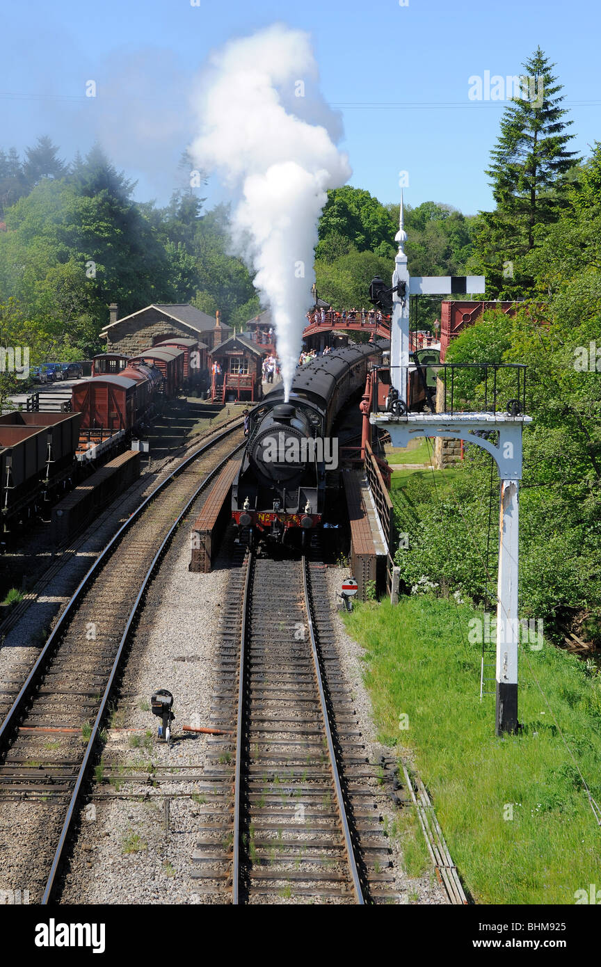 Steam train leaving Goathland station North Yorkshire UK. Stock Photo