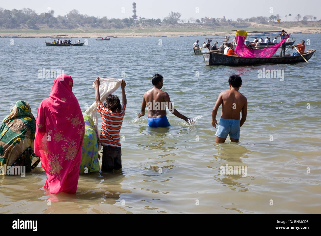 Hindu pilgrims bathing in the confluence of the Ganges and Yamuna rivers (Sangam). Allahabad. India Stock Photo