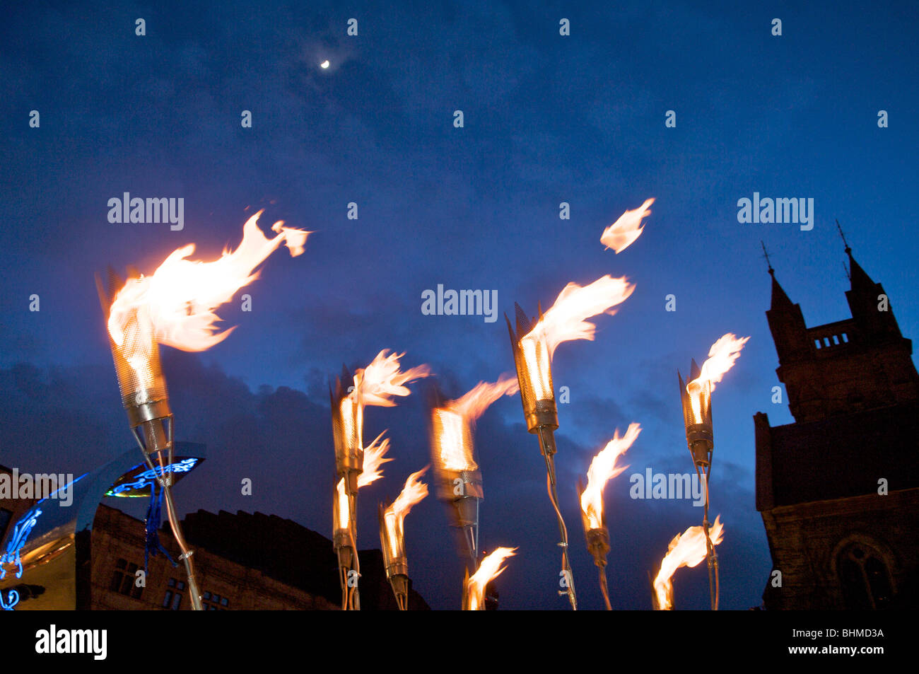 Burning torches against night sky Stock Photo