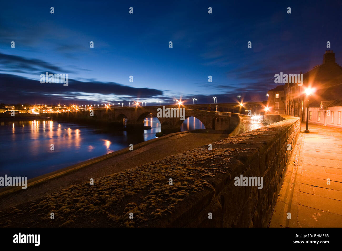 Berwick upon Tweed a night time view of the 'Old Bridge' from the town walls Stock Photo