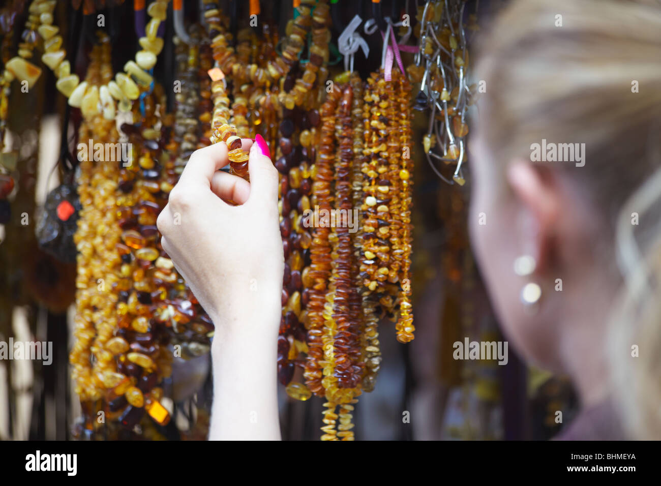 Woman Holding Amber Jewellery, Vilnius, Lithuania, Baltic States, Eastern Europe Stock Photo