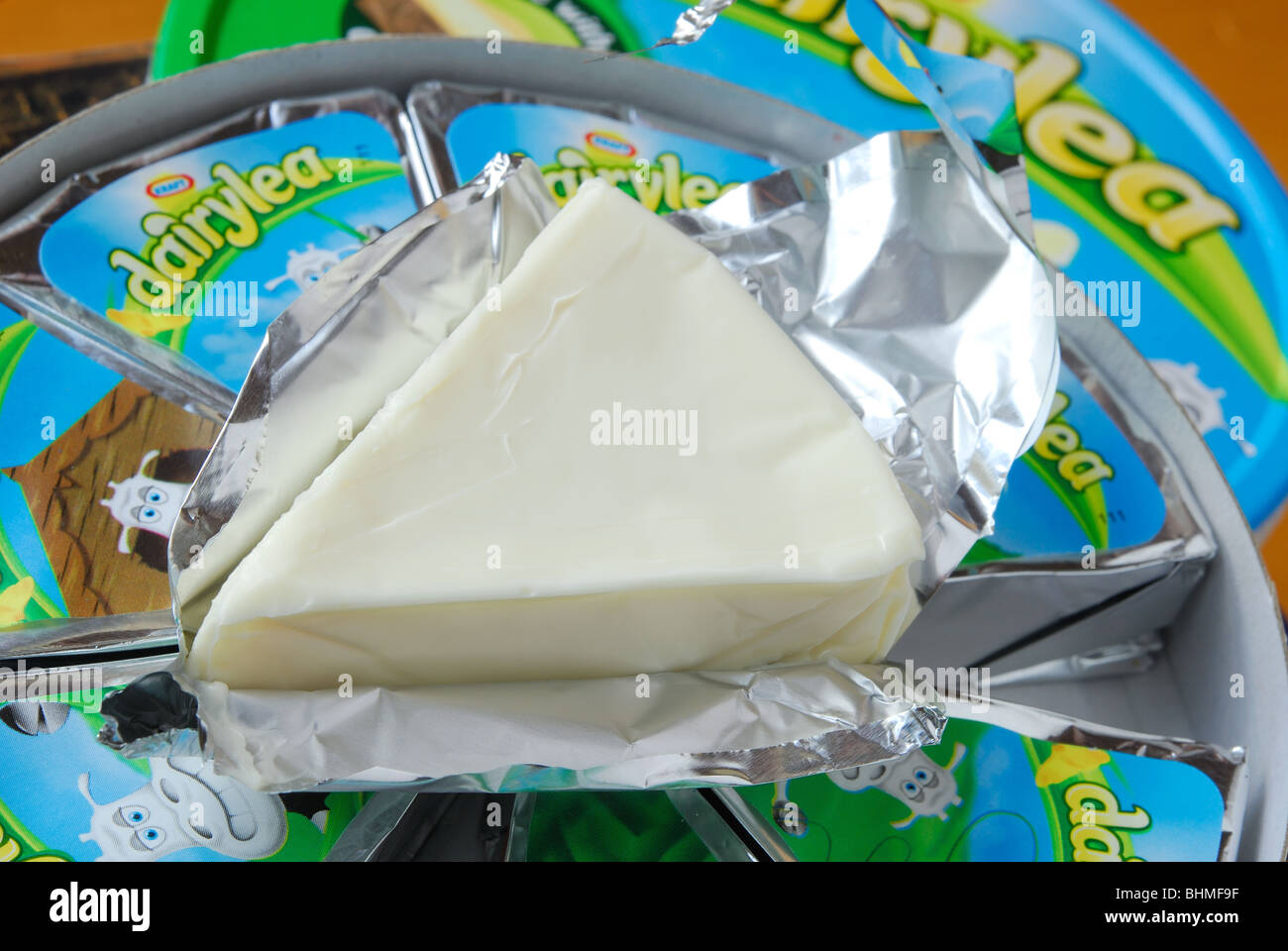 A Kraft Dairylea cheese triangle, unwrapped from its foil. Stock Photo