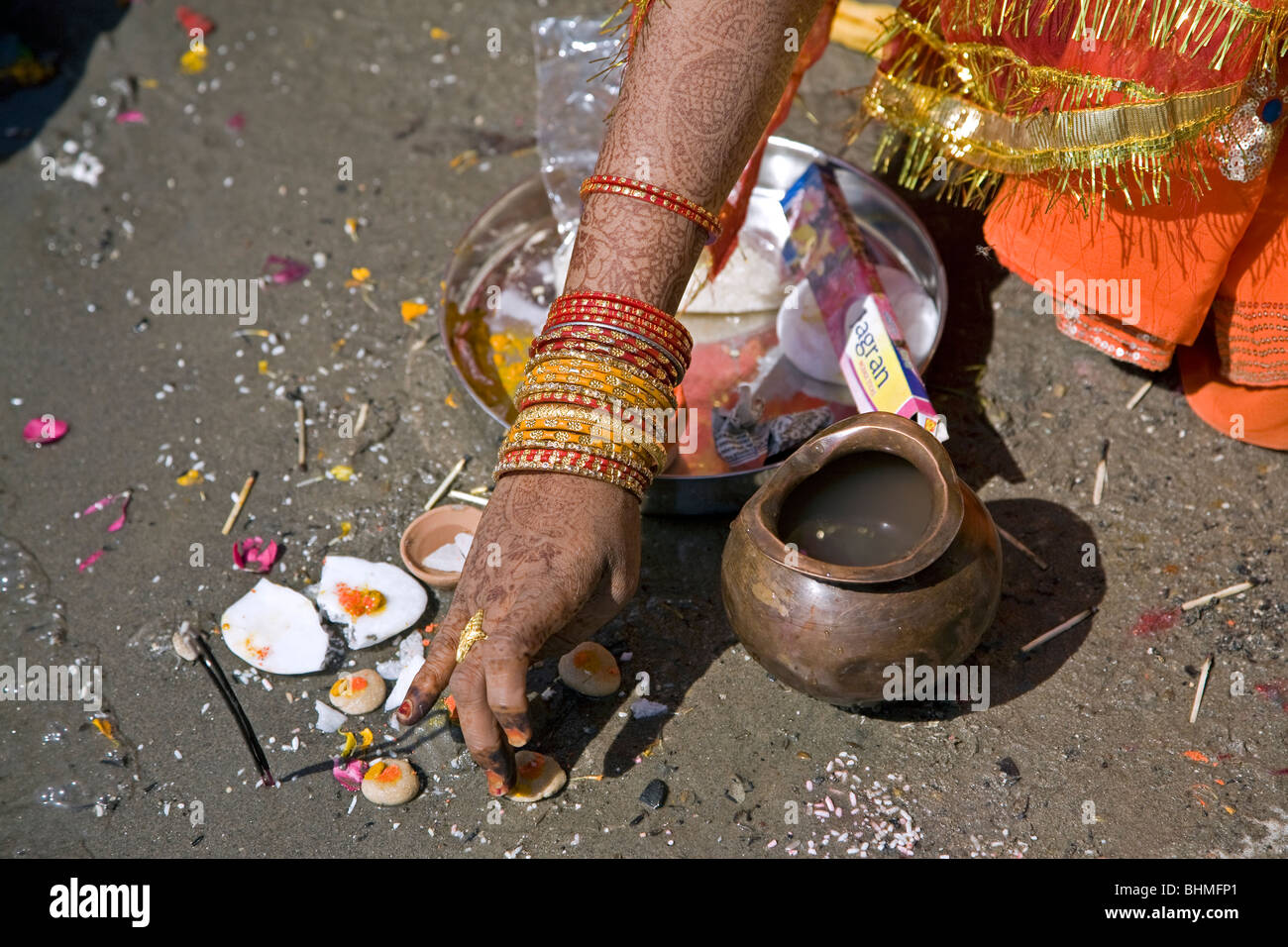 Indian bride making a puja (ritual offering). Ganges river. Allahabad. India Stock Photo
