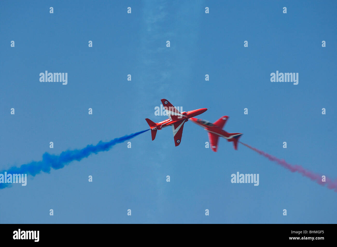 Red Signs Flying red arrows fly flight display over smoke formation Stock Photo - Alamy